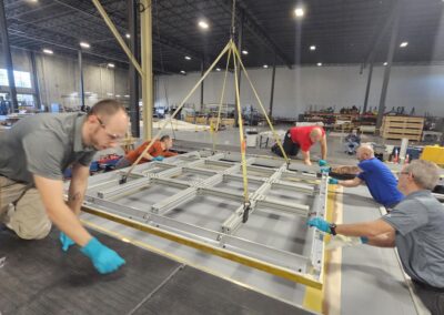 Photo of team Fabricating an Electromagnetic Window radome at the Sheergard factory in Salem, NH USA.